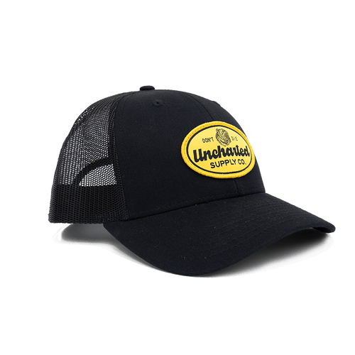 Pathfinder Trucker Hat, black with yellow Uncharted Supply Co. 'Don't Die' bear patch, mesh back