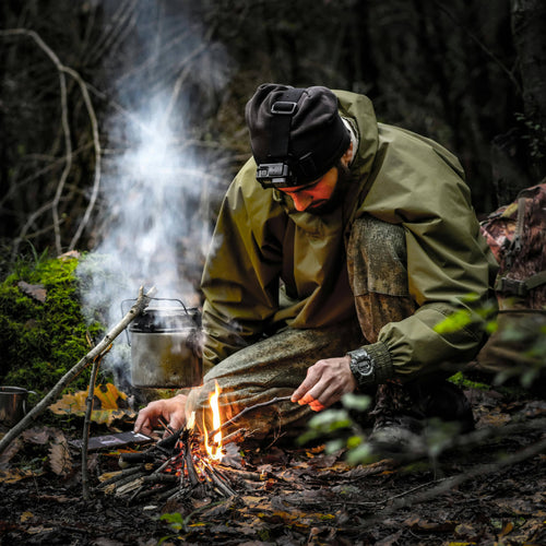 Black Beard Fire Starters Pirates Plunder Kit in use, camper builds a fire with a pot for outdoor cooking