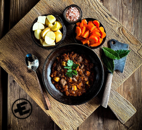 Meal (Ready-to-Eat) variety pack by Essential Provisions, hearty stew with potatoes & carrots on rustic wood