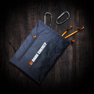 Dark Energy Spectre Accessory Kit - Folding, a gray tactical gear pouch with carabiners and orange stakes on wood