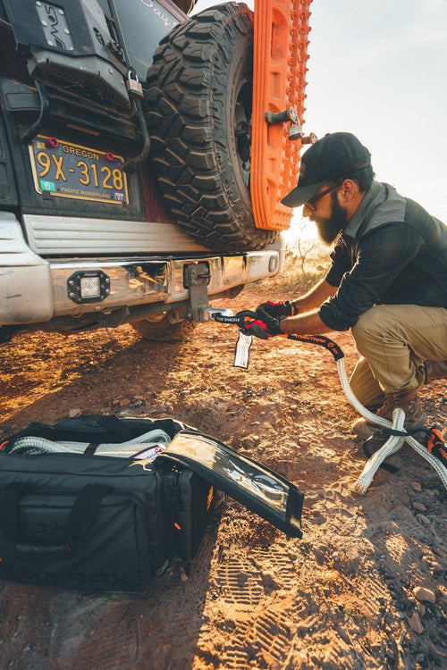 Adventure Imports MAXTRAX Fuse Shackle connects recovery rope to a truck hitch, essential off-road gear