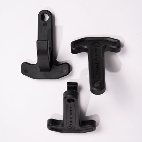 Three black Rasant T^Pull Straps, plastic gear fasteners for securing equipment