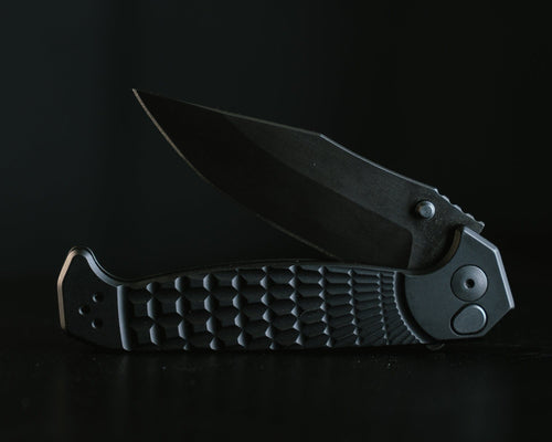 Half Face Blades Crow Folder, black tactical folding knife with grenade stippled grip