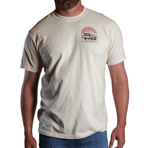 Death Avoidance Specialist T-shirt in cream with Uncharted Supply Co overland vehicle and trees graphic