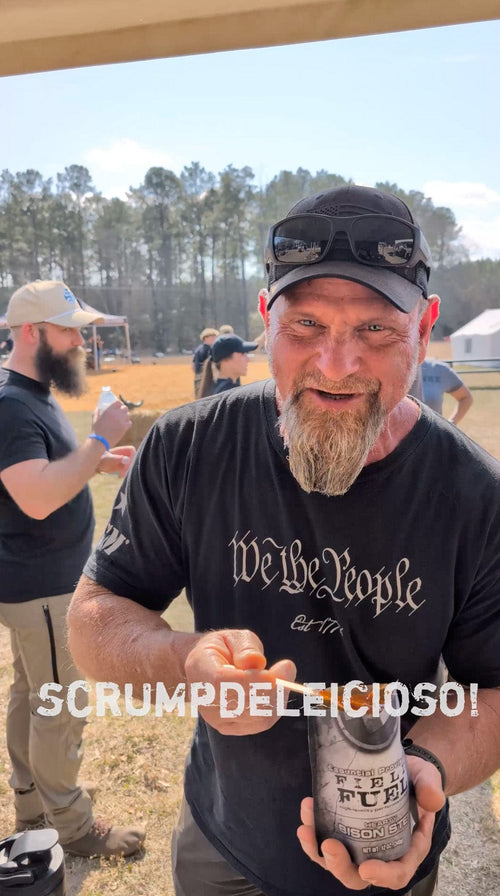 Essential Provisions Field Fuel BISON CHILI MRE, man smiles enjoying his ready-to-eat meal outdoors