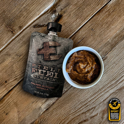 Essential Provisions Sustain salted almond vanilla energy blend, pouch and bowl of product on wood