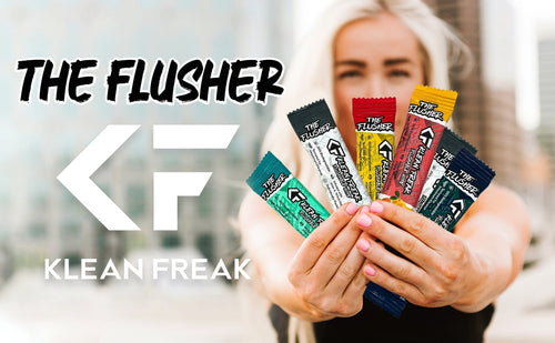 The Flusher flushable wipes by Klean Freak, multiple colorful individual packets held by a woman