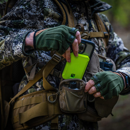 Poseidon Nano by Dark Energy, a bright green rugged portable charger, put into a tactical pouch with a phone