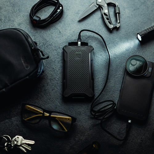 Dark Energy Poseidon Pro rugged power bank charging phone with tactical gear