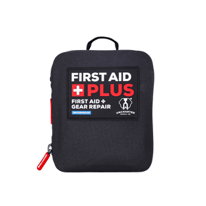 A black, waterproof first aid plus gear repair kit with red and white text on the front, a zipper, and a red pull tab.