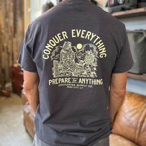 Conquer Everything T-Shirt - Blue back, detailed graphic of bear & hunter in mountains, Uncharted outdoor gear