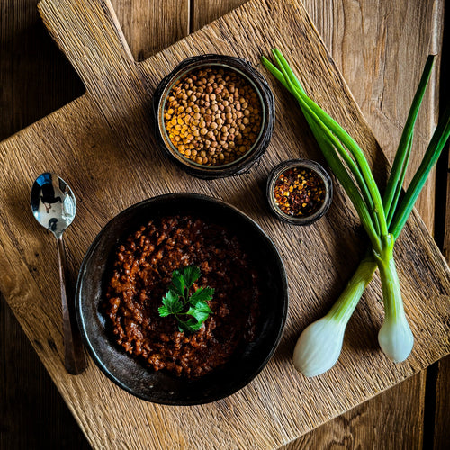 Essential Provisions LENTIL CHILI, a hearty ready-to-eat vegan meal, presented with fresh ingredients