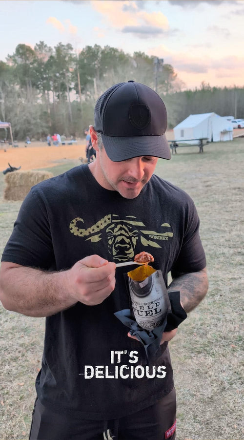 Essential Provisions Meal (Ready-to-Eat) Variety Pack, man eats Field Fuel from pouch outdoors
