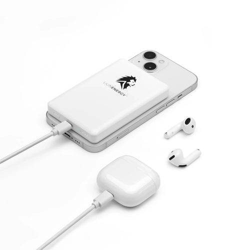 Lion Claw portable power bank charging a silver smartphone and white AirPods with case