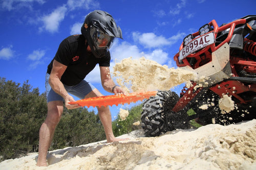 MAXTRAX Mini + JaxBase Combo traction boards aid off-road vehicle stuck in sand with flying debris