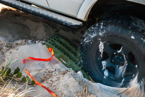 MAXTRAX Xtreme Olive Drab Recovery Boards by Adventure Imports helping a vehicle gain traction in deep sand