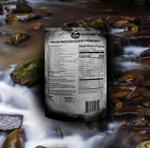 Essential Provisions Ready-to-Eat VEGETABLE STEW flexible pouch with nutrition facts in a flowing river, survival meal