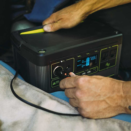 Ignik Flipside Heated Bed Cover, powered by a portable power station plugged into a 12V outlet