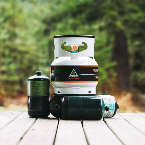 Ignik Gas Growler 3.8 Naked refillable propane tank with two disposable fuel cylinders outdoors