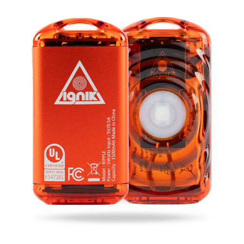 Ignik Ripple Rechargeable Hand Warmers, two orange units, one showing logo & specs, the other its glowing core for portable warmth