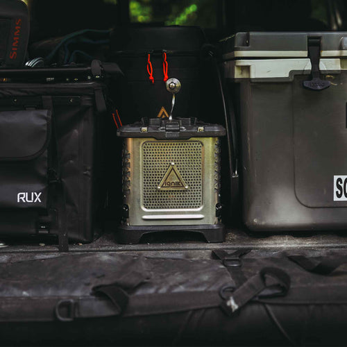 Ignik Skullet Deluxe Heater Stove Cook Set, portable camping stove, packed in a truck bed with RUX bin & RTIC cooler