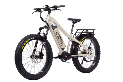 Bakcou Mule electric fat tire bike in light tan with rugged tires, front suspension, and rear rack