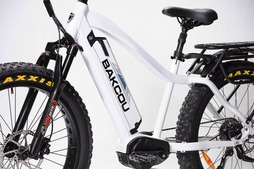 Mule Bakcou white fat-tire electric hunting bike with front suspension, mid-drive motor, rear rack