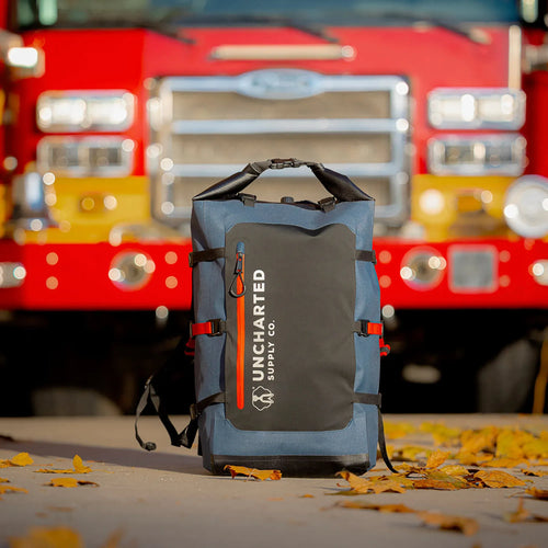 Blue Seventy2.0 Survival System in front of a fire engine