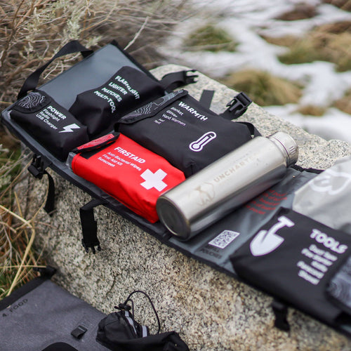 An open seventy2 insert laying on a rock in a snowy landscape