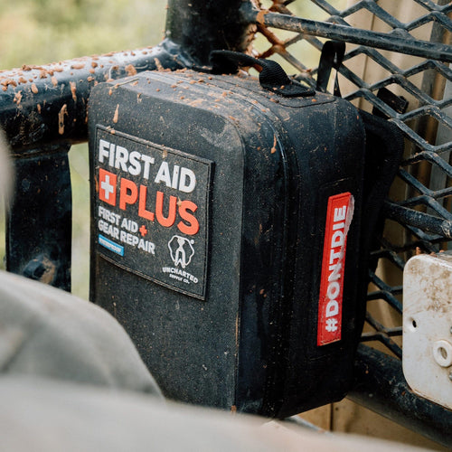 first aid plus using it's molle attachment points to hold itself to a muddy UTV