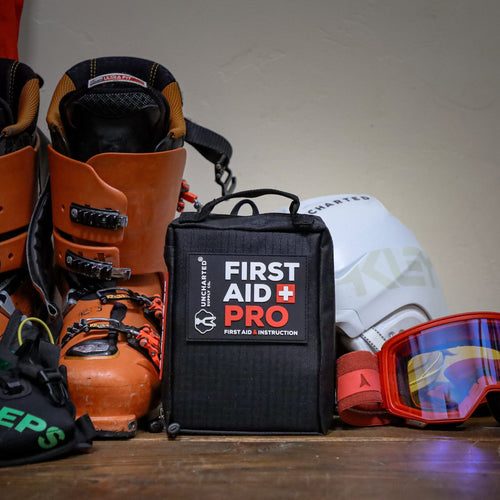 first aid pro next to ski boots and goggles