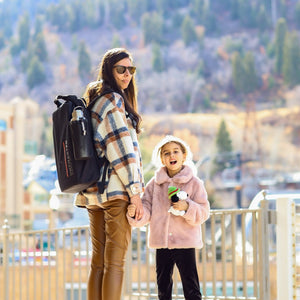 Mother and daughter holding hands, mother is wearing the seventy2 core