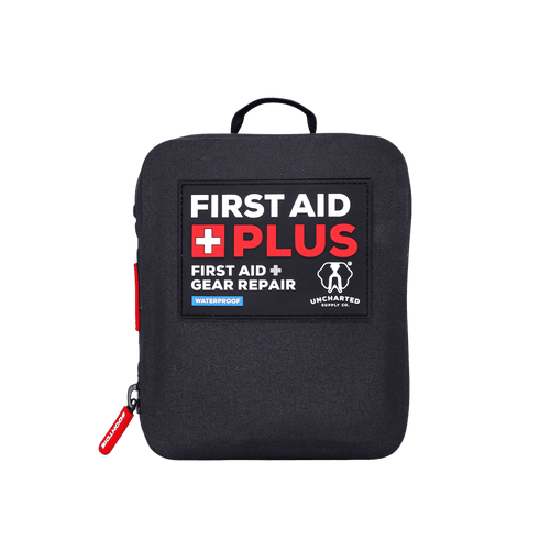 A black, waterproof first aid plus gear repair kit with red and white text on the front, a zipper, and a red pull tab.