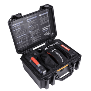 An open roadster auto kit box with contents organized inside