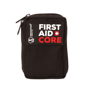A black first aid kit with the label 'FIRST AID CORE' written in white and red on the front.
