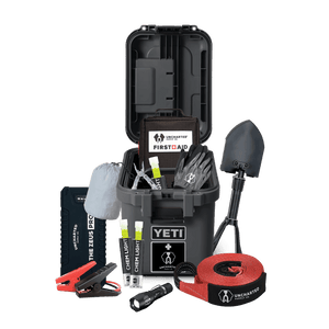 A weather-proof Overlander vehicle preparedness kit, displayed open to show contents including tools and emergency gear.