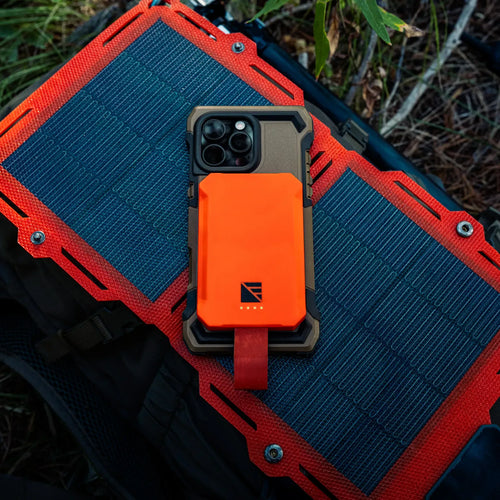 Dark Energy Poseidon Nano magnetic power bank on rugged phone case, solar panel on outdoor backpack