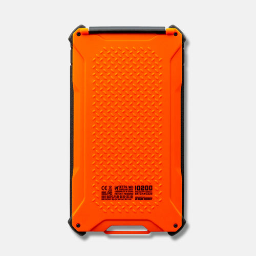 Poseidon Pro: Dark Energy orange and black rugged portable power bank with textured back, showing technical specs