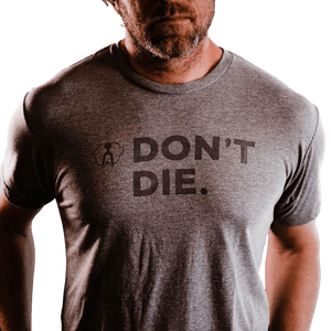 Don't Die T-shirt in heather grey on a man, showing 