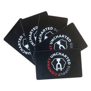 Physical Gift Card from Uncharted Supply Company, black cards with white elephant logo for adventure gear