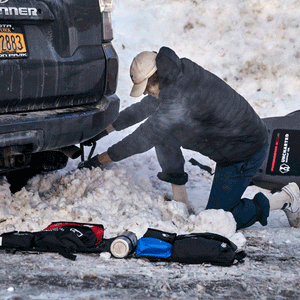 Uncharted Supply Co. survival Shovel/Axe clearing snow from under Toyota 4Runner